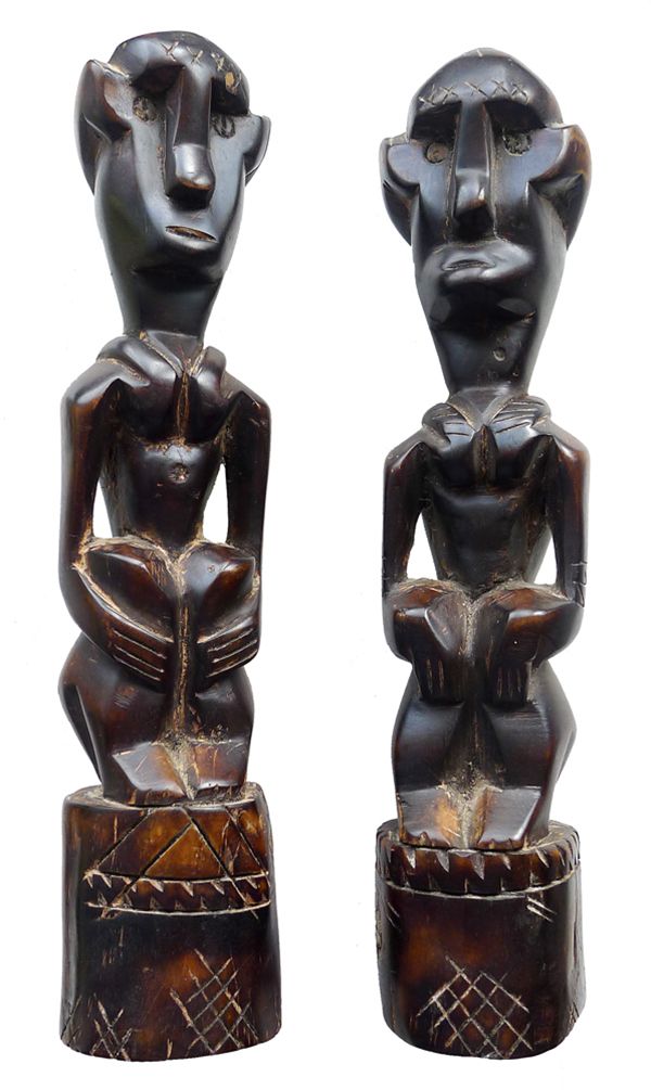 Pair of Sumban Seated Ancestor Figures